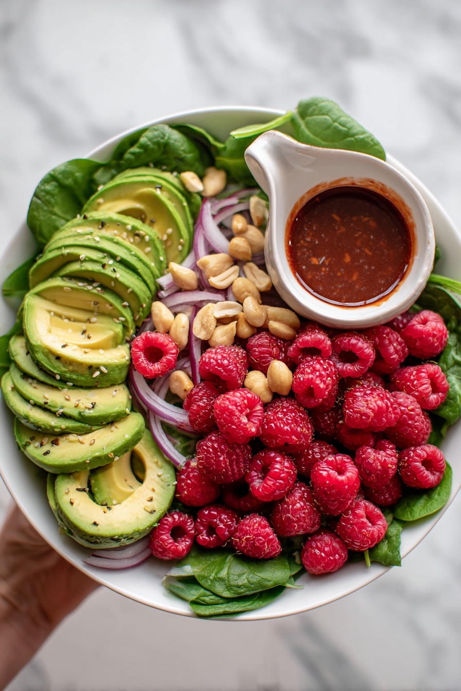 A clear glass mixing bowl sits on a white marbled surface, filled with a bright yellow liquid mixture containing small pieces of finely chopped onions and orange zest. A shiny metal whisk rests inside the bowl, partly immersed in the mixture, with its handle extending out to the left side. To the top left of the bowl, a white cloth with brown stripes is casually placed, adding texture to the scene. The lighting highlights the glossy surface of the bowl and the liquid inside, creating a fresh and clean look. photo taken with an iphone --ar 2:3 --v 7