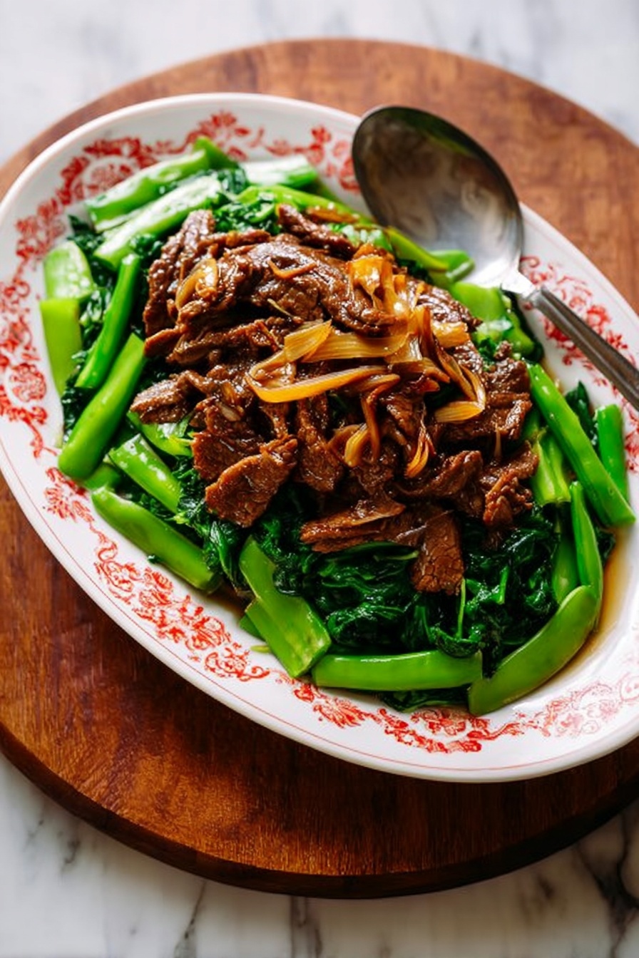 A deep white bowl holds a base layer of fluffy white rice with clear, separated grains. On top of the rice, there are several glossy pieces of dark brown meat coated in a shiny sauce. Thin slices of red chili and green chili are scattered over the meat, adding bright red and green colors and a fresh texture. A pair of turquoise chopsticks rests on the edge of the bowl. The bowl sits on a white marbled surface. Photo taken with an iphone --ar 2:3 --v 7
